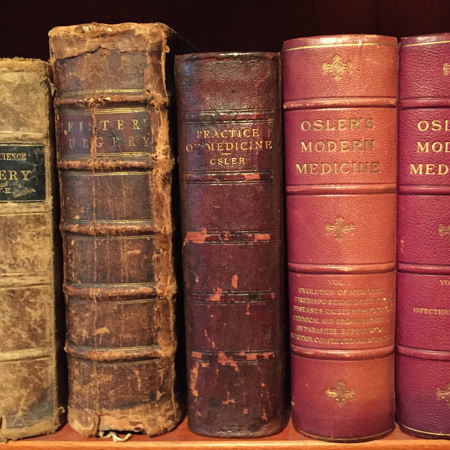 rare medical books on bookshelf 