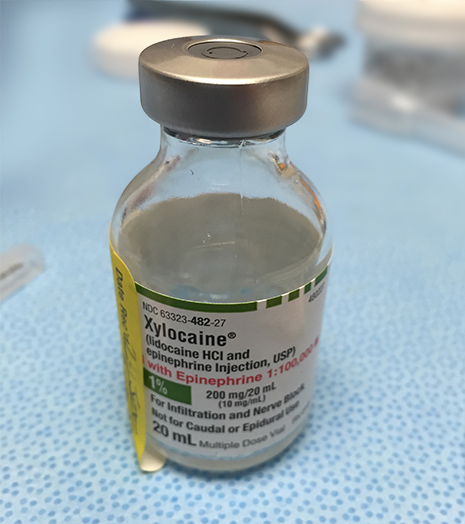 Bottle of anesthetic on table