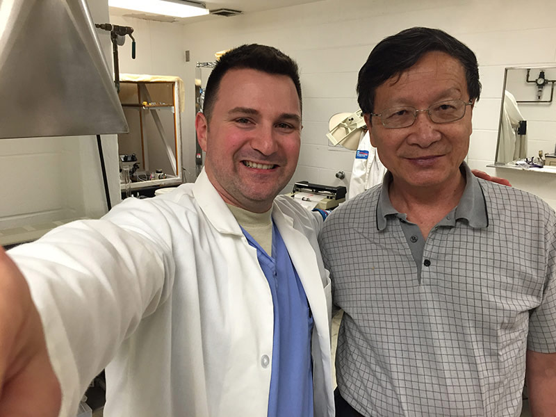 John and Dr Li in the research lab