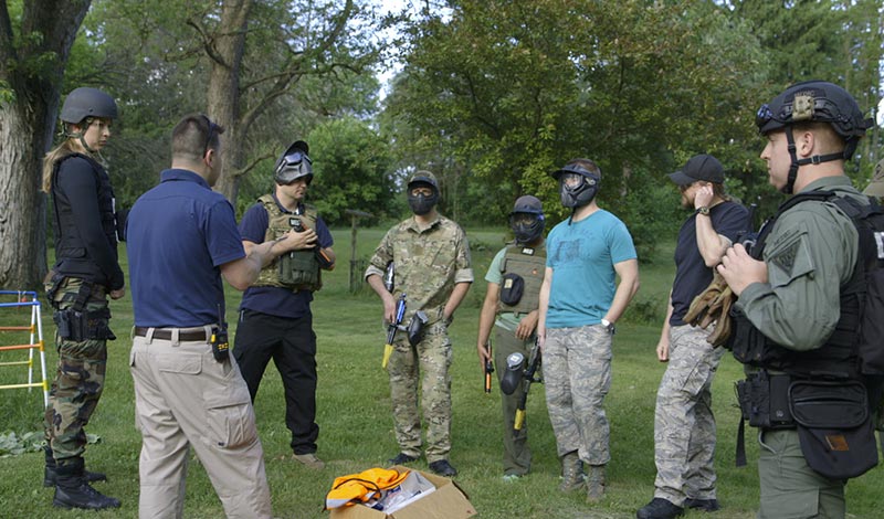 Emergency medicine medics gather around John for instructions