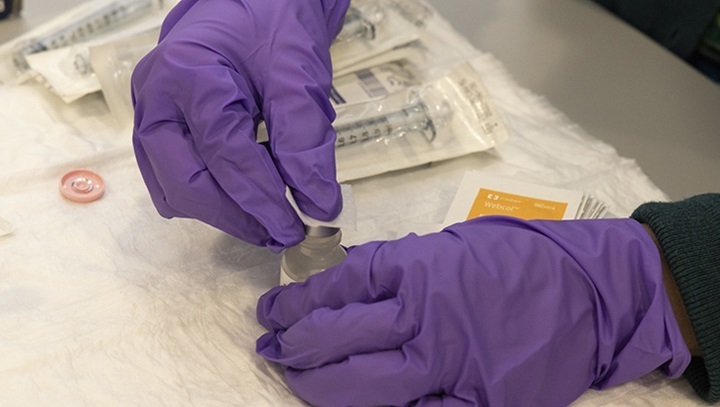 A research coordinator at the Walter Reed Army Institute of Research Clinical Trials Center prepares samples prior to the RV575 research study on Sept. 27, 2022. 