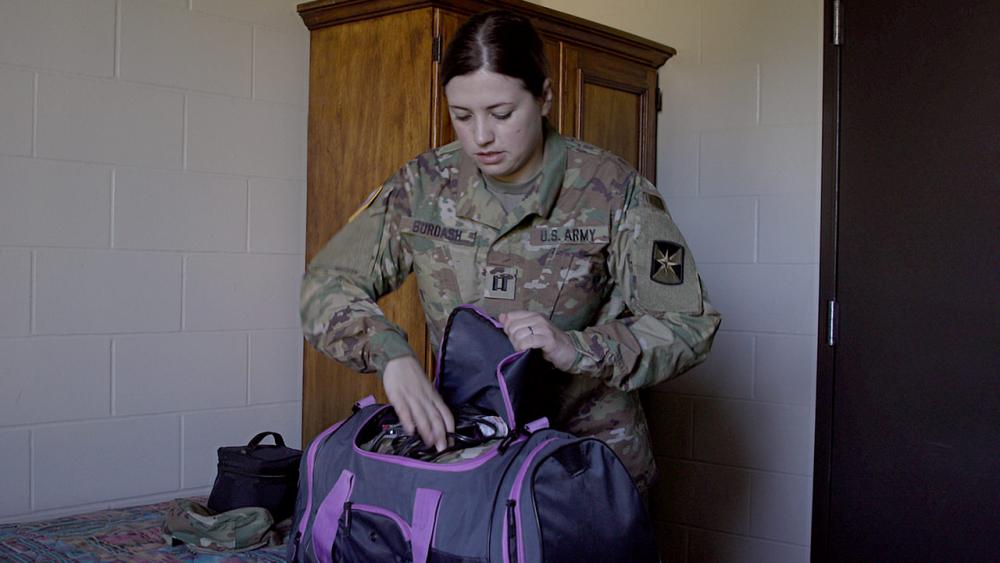 Sara unpacking her bag.