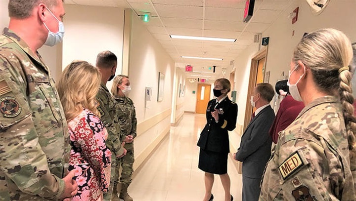 Photo showing Army Brig. Gen. Katherine Simonson, Defense Health Agency Deputy Assistant Director of the Research and Engineering Directorate, and Dr. Barclay Butler, Assistant Director for Management, DHA, talks with Army Lt. Col. Samantha Rodgers, Ophthalmology chief (left), during a tour and designation ceremony April 19 at the Ocular Trauma Center – San Antonio Region, 