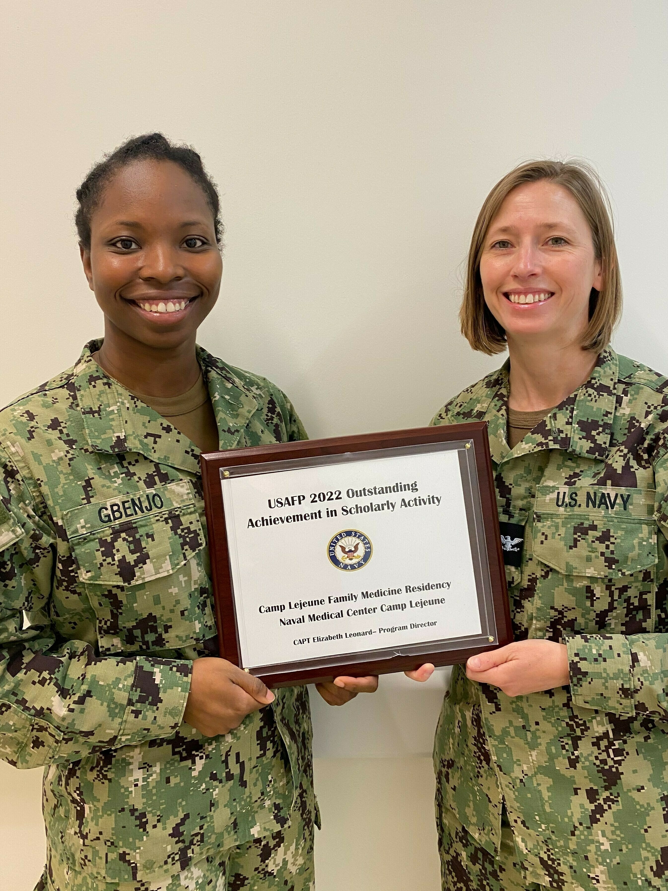 Image of Naval officers with the USMP 2022 Outstanding Achievement in Scholarly Activity Award