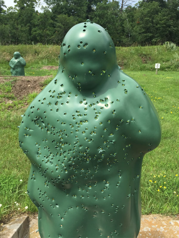 Close up of green, man-shaped target