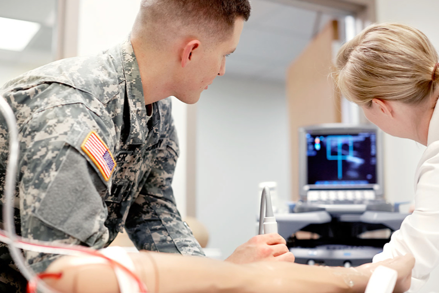 Military personnel working in a medical environment