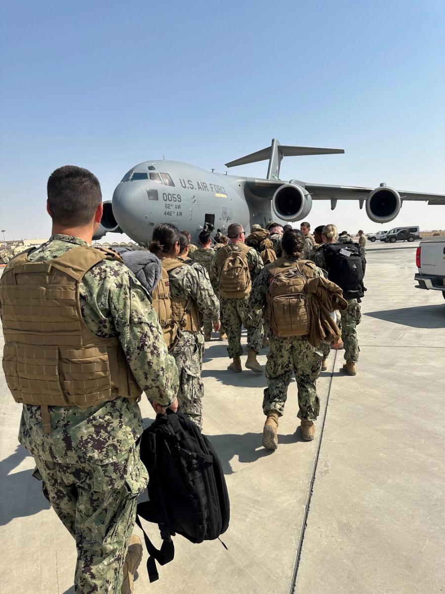 221020-N-N1526-0001 Erbil Air Base, Iraq (Oct. 20, 2022) Personnel assigned to Navy Expeditionary Medical Unit 10- Gulf (NEMU 10G), Rotation 13 board an Air Force C-17 as they prepare to leave Kuwait for Erbil, Iraq on Oct. 20, 2022.