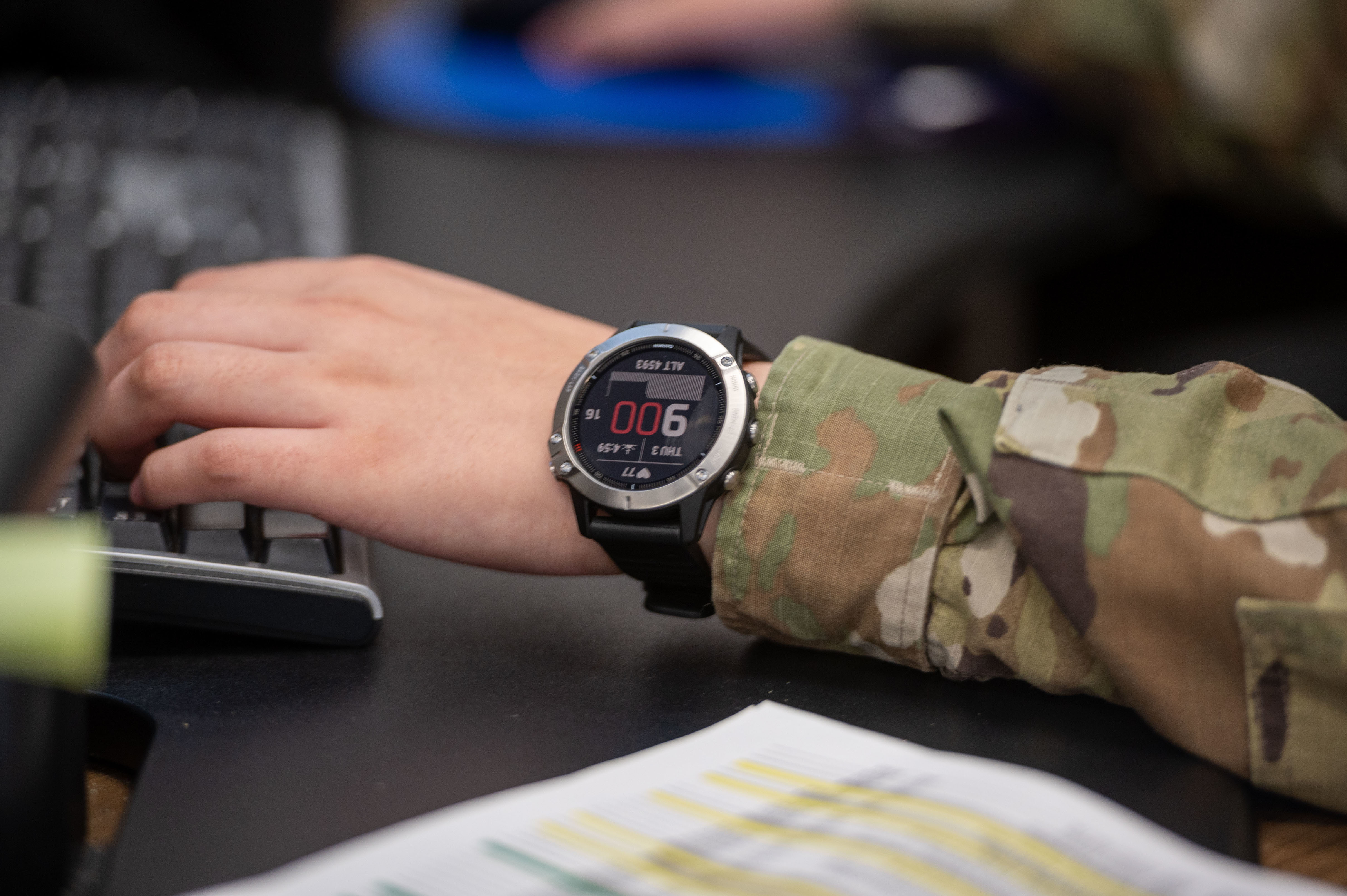 An Airman wears a watch as part of the wearable technology